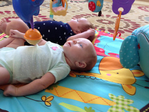 Starting to enjoy their activity mat